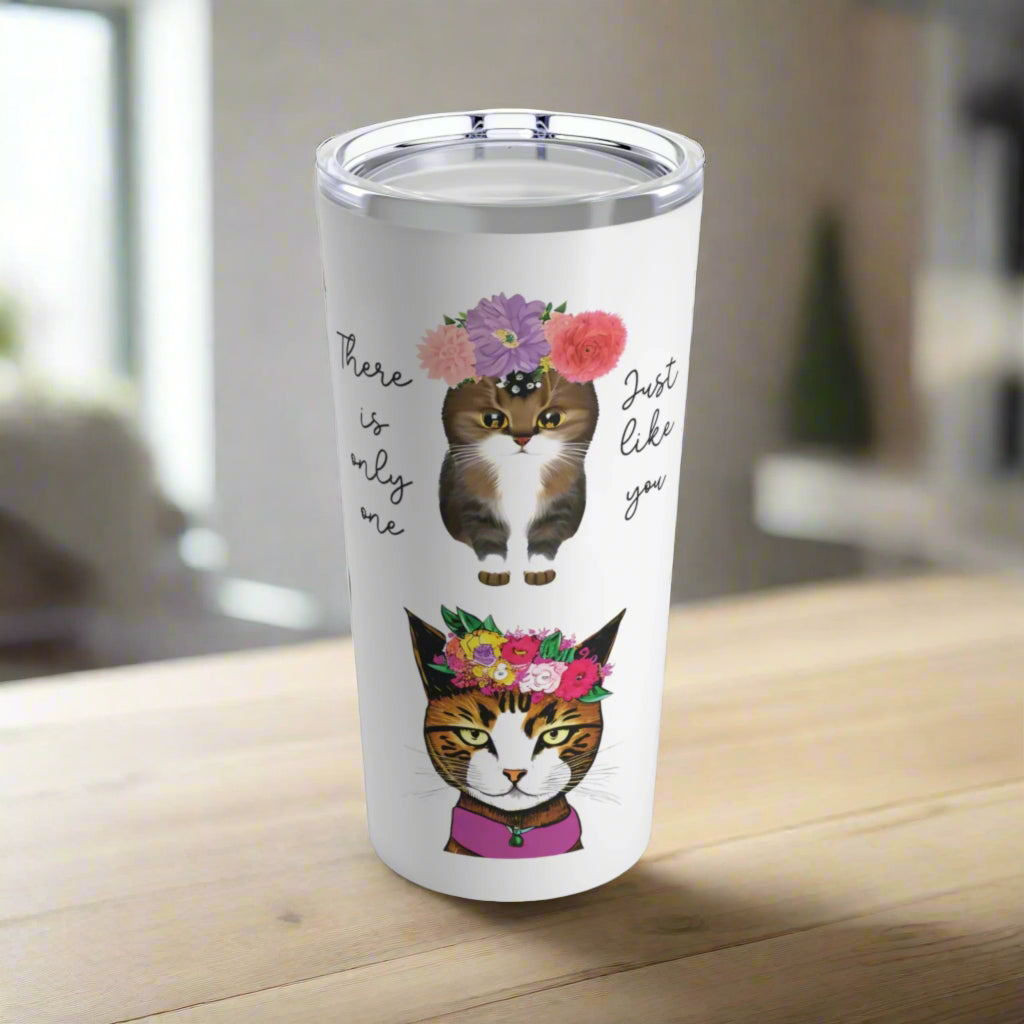 A 20oz stainless steel tumbler with a see-through plastic lid, featuring a glossy finish. The tumbler has a motivational message 'There is Only One Just Like You' and illustrations of cats with floral crowns.